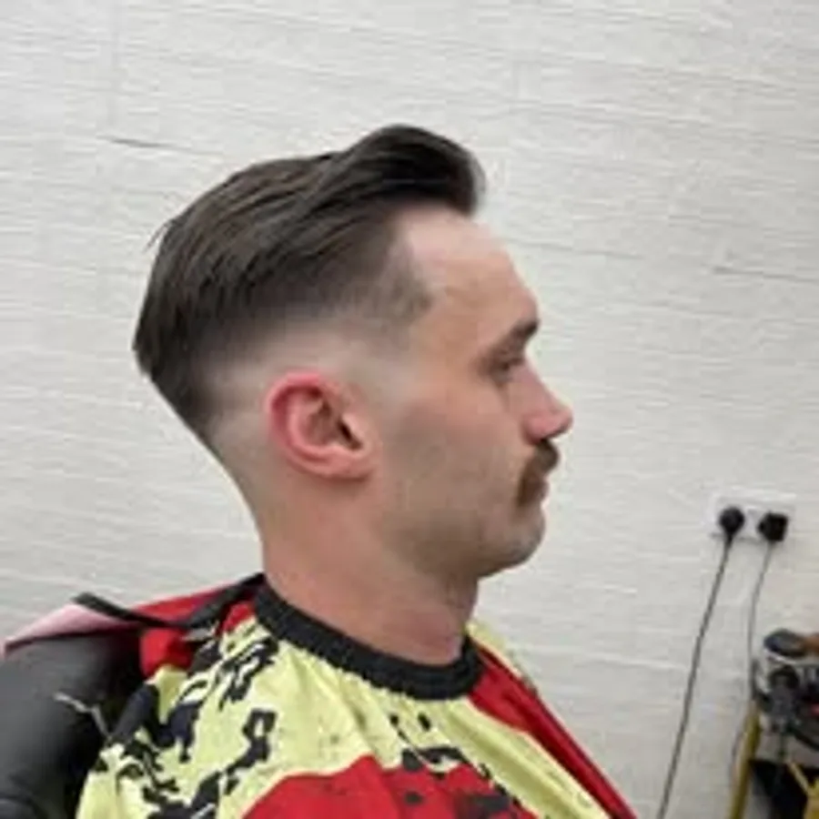 Sharp side-swept skin fade