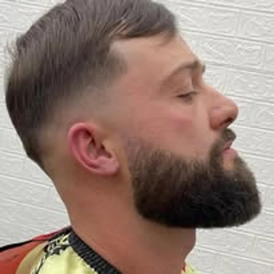 Skin fade with shaped beard